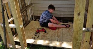 Maddox building a dog house